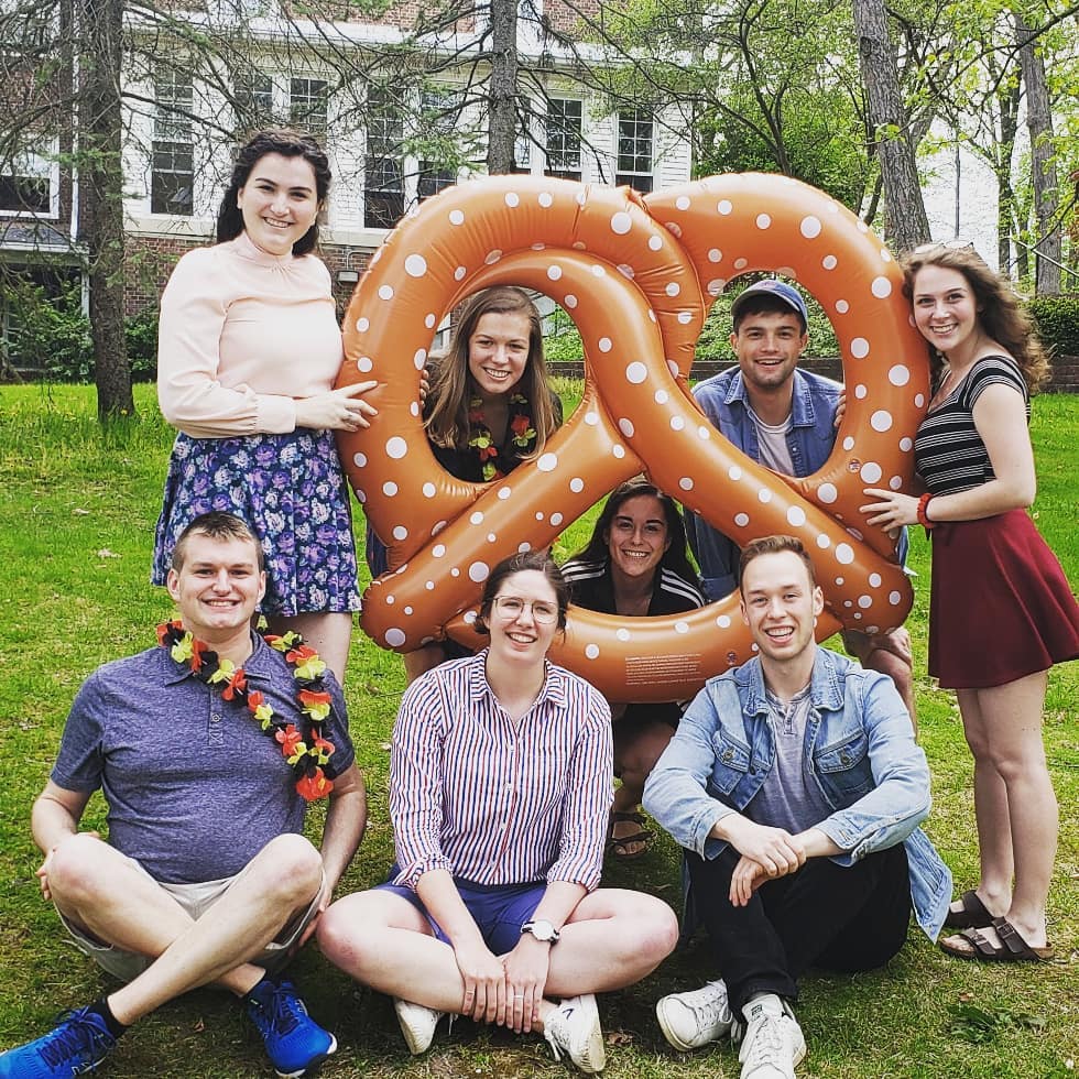 German students out on campus with a giant pretzel